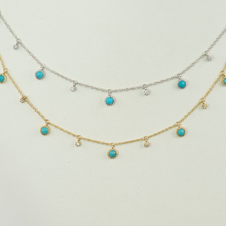 This white diamond and turquoise necklace is available in either white or yellow gold. The gold is 14kt. The diamonds are round, brilliant cut and the turquoise is from the sleeping beauty mine. 
