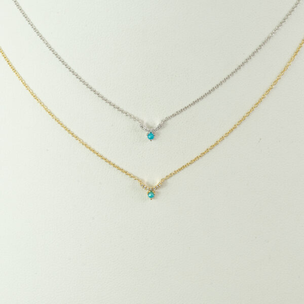 This tiny turquoise pendant is available in 14kt white gold and 14kt yellow gold. The turquoise is sleeping beauty and the diamonds are brilliant cut.