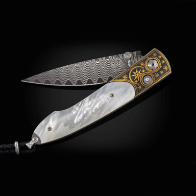 This is the night sky by William Henry. It has mother of pearl, koftgari, wave damascus and white topaz in the thumb stud and button lock. 22 of 50 produced
