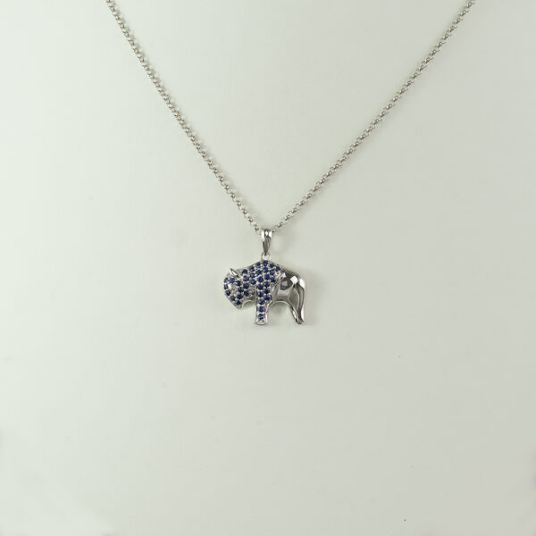 This sapphire buffalo pendant was made with white gold. The gold is 14kt and the chain is not included in the price. Also, available in yellow gold.