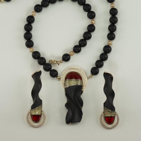 Intarsia: Sculpted Black Onyx and Fire Opal Pendant