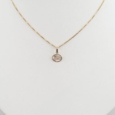 This is our tiny diamond Teton pendant. It was cast in 14kt yellow gold. The diamonds are brilliant-cut. The chain is sold separately. 