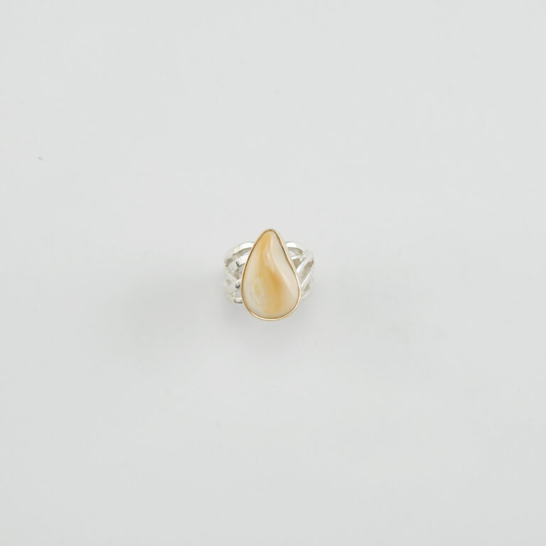 Here is a bull elk ivory ring. The elk ivory has been set in 14kt yellow gold. The ring shank is made with sterling silver.