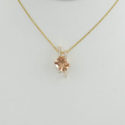 This morganite pendant has been set in 14kt yellow gold. Accenting the morganite are white diamonds. The chain is not included in the price.