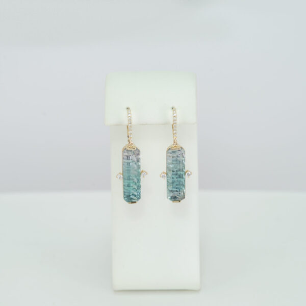 Bi color tourmaline earrings with diamonds and gold.